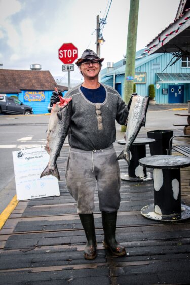 A Prince Rupert fisherman celebrates a successful day on the ocean in Cow Bay, the city’s tourist area. Salmon are integral not only to First Nations culture, but the culture of the entire coastal Skeena region.Ash Kelly