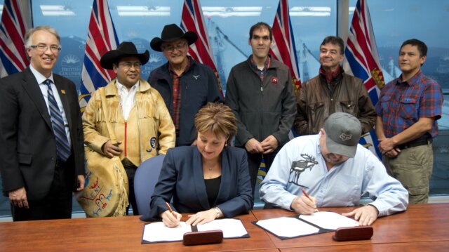 Premier Christy Clark, with members of the Tsilhqot’in Nation signing the Nenqay Deni Accord on Feb 16, 2016. Province of British Columbia 