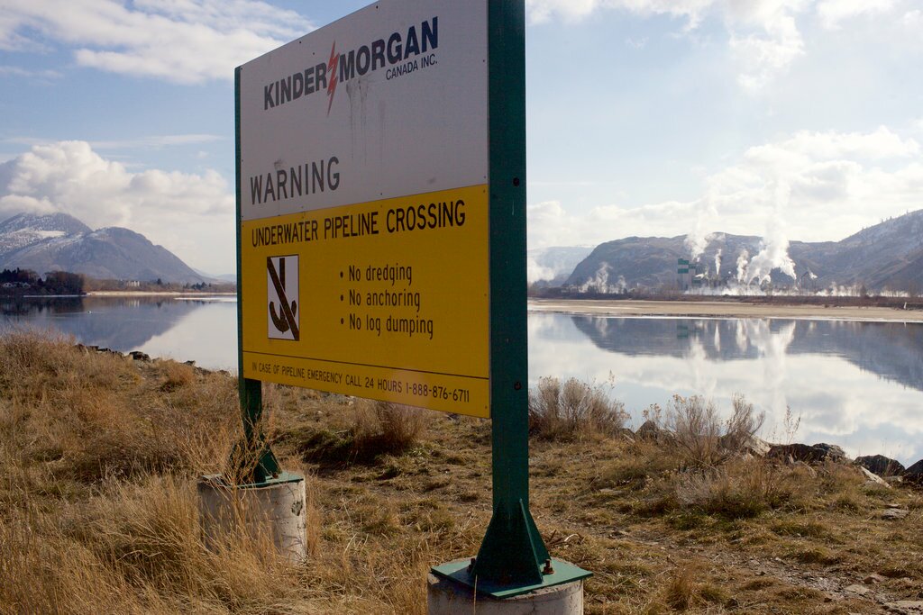 A Kinder Morgan Canada sign marks the spot where the Trans Mountain pipeline crosses the Thompson River in Kamloops, British Columbia. Patrick Michels for Reveal
