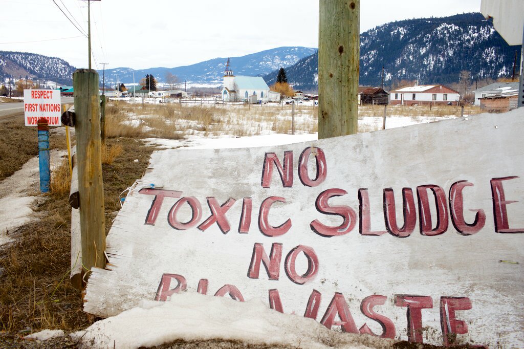 Signs around the Lower Nicola Indian Band Reserve remain from a victorious 2015 campaign to stop a program that trucked treated waste from suburban Vancouver into their valley. Patrick Michels for Reveal