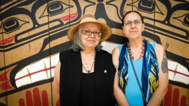 Clan aunties Christine Carty (left) and Georgia Bennett (right) outside the Haida House in Old Massett, Haida Gwaii.