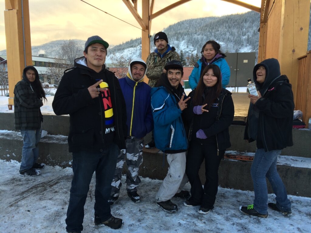 This group of people in Smithers, B.C. spends their days at the outdoor stage in Bovill Square. Desiree Naziel, 24 (second from right, wearing black), says she understands why some people in Smithers are uncomfortable with the homeless population. She says the town needs more shelter beds. Trevor Jang
