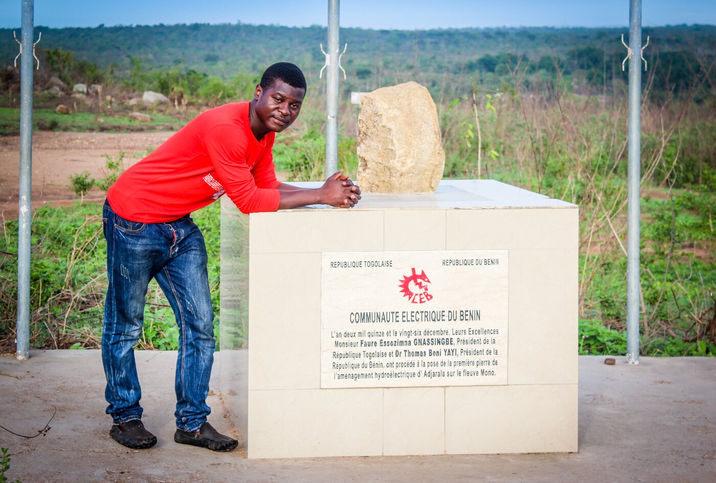 Reporter Kossi Elom Balao at the foundation stone for the Adjarala dam. Marcel Ellah Tchegnon 
